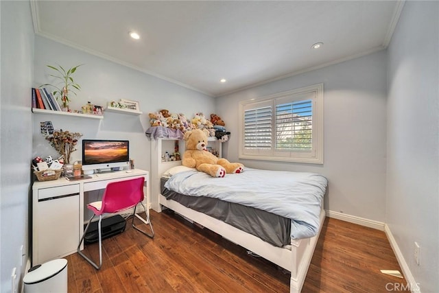 bedroom featuring crown molding and dark hardwood / wood-style floors