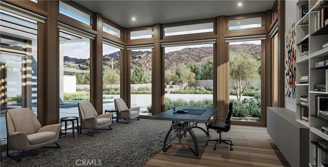 sunroom featuring a mountain view