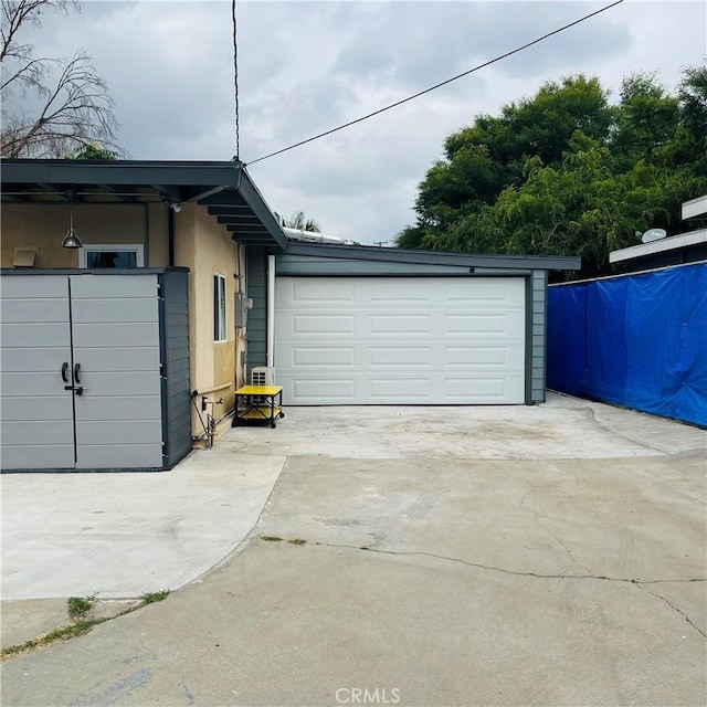 view of side of property with a garage