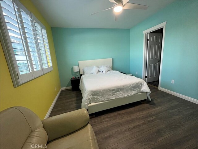 bedroom with dark wood-type flooring and ceiling fan