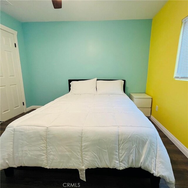 bedroom featuring hardwood / wood-style floors and ceiling fan