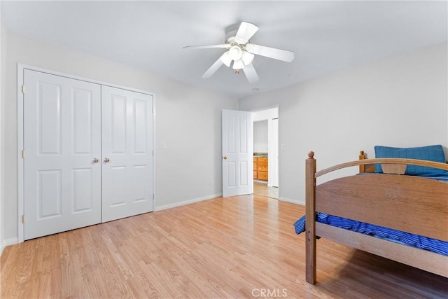 bedroom with ceiling fan, a closet, and light wood-type flooring