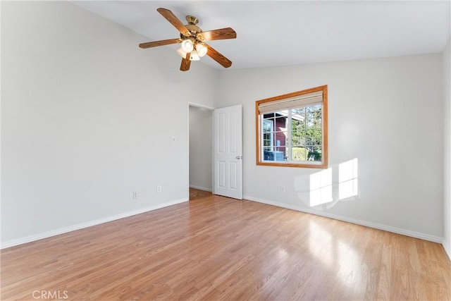 unfurnished room with vaulted ceiling, ceiling fan, and light hardwood / wood-style floors