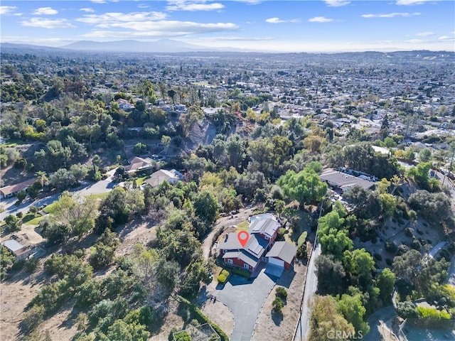 birds eye view of property with a mountain view