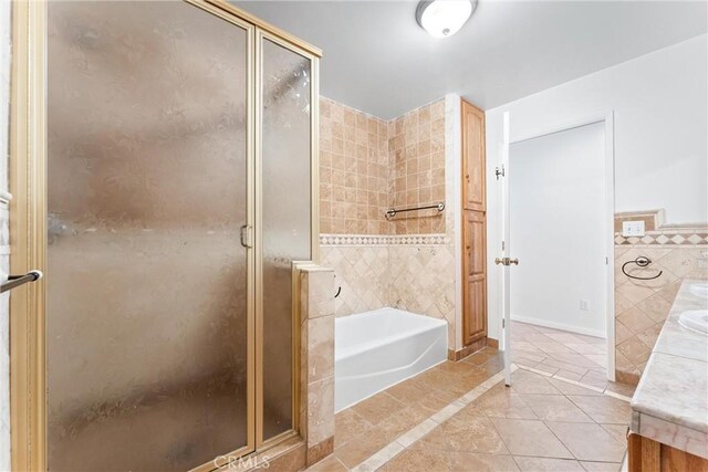 bathroom with plus walk in shower and tile patterned floors