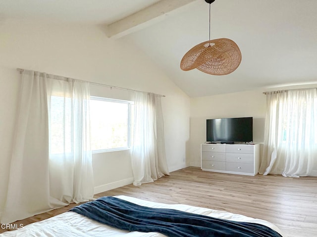 unfurnished bedroom with beam ceiling, high vaulted ceiling, and light wood-type flooring