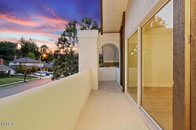 view of balcony at dusk