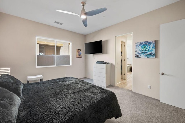 bedroom featuring ceiling fan and light colored carpet