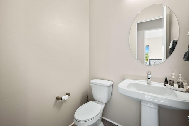 bathroom with toilet and sink