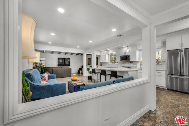 living room featuring crown molding