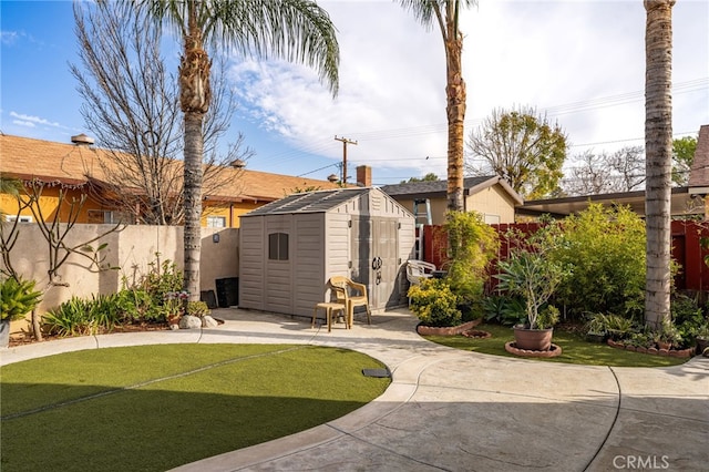 exterior space with a yard, a patio area, and a storage unit