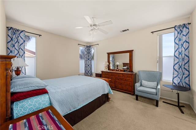 bedroom featuring ceiling fan and light colored carpet