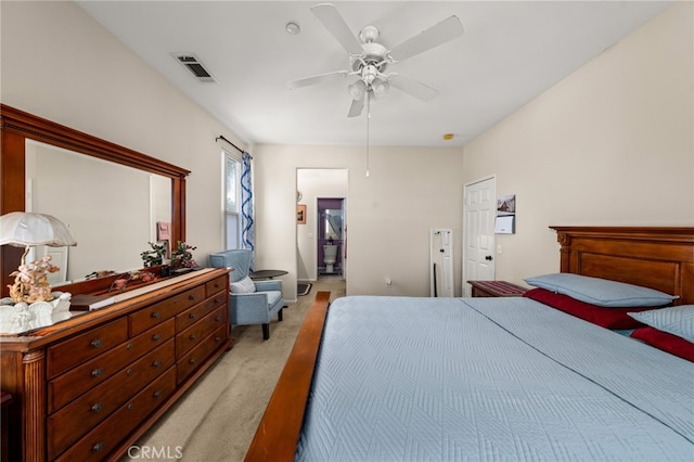 bedroom featuring ceiling fan and light carpet