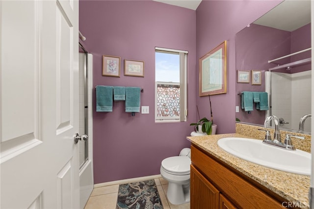 full bathroom featuring tile patterned flooring, vanity, bathtub / shower combination, and toilet