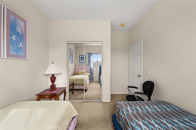 bedroom featuring a closet and carpet flooring