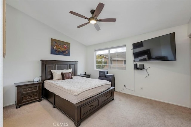 carpeted bedroom featuring lofted ceiling and ceiling fan