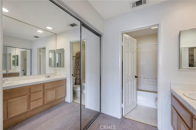 full bathroom featuring vanity, toilet, and shower / bath combo with shower curtain