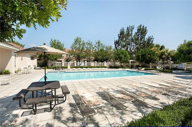 view of swimming pool featuring a patio area