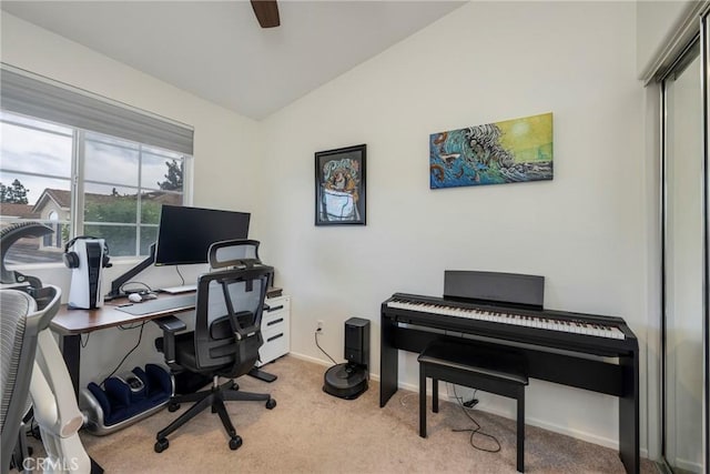 office with ceiling fan, vaulted ceiling, and light carpet