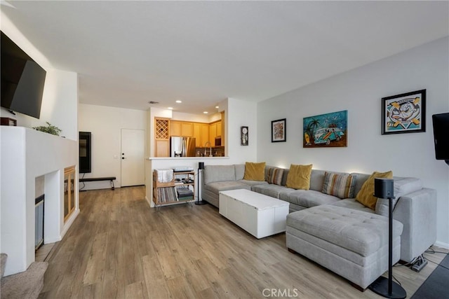 living room with light hardwood / wood-style floors