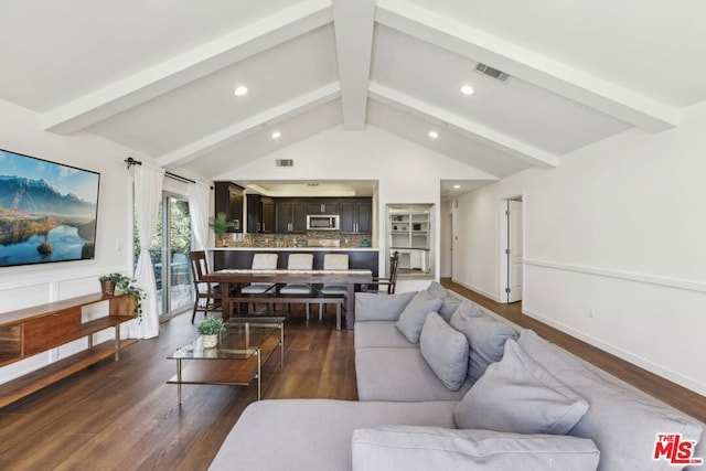 living room with dark hardwood / wood-style flooring and lofted ceiling with beams