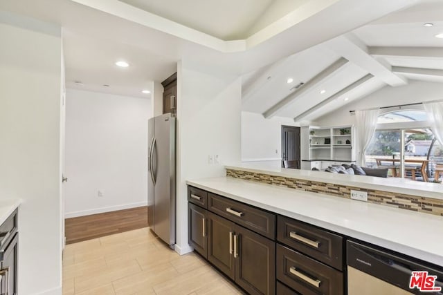 kitchen featuring dark brown cabinetry, appliances with stainless steel finishes, decorative backsplash, and vaulted ceiling with beams