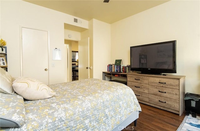 bedroom featuring dark hardwood / wood-style floors