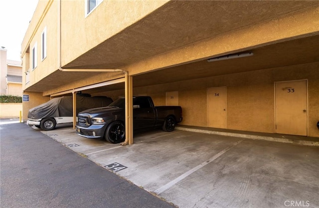 view of vehicle parking featuring a carport