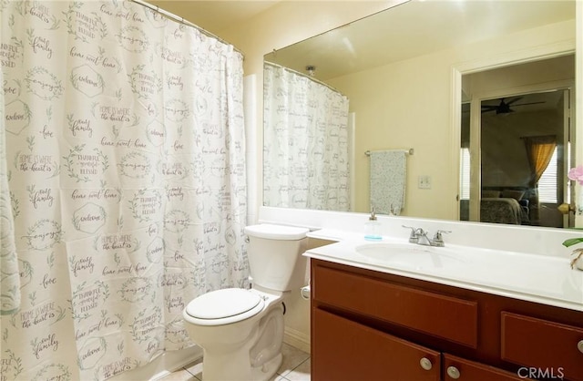 bathroom with vanity, tile patterned floors, ceiling fan, and toilet