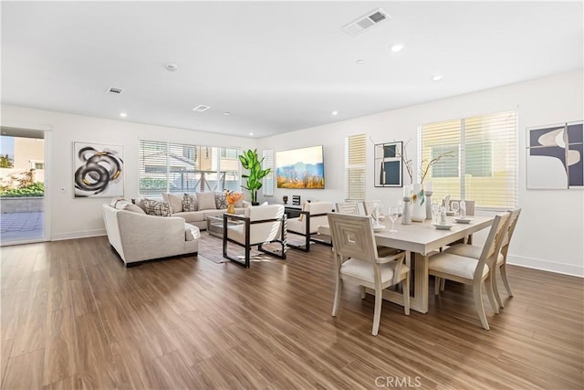 dining room with dark wood-type flooring