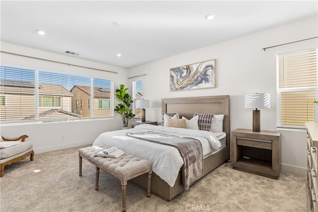 bedroom featuring light carpet