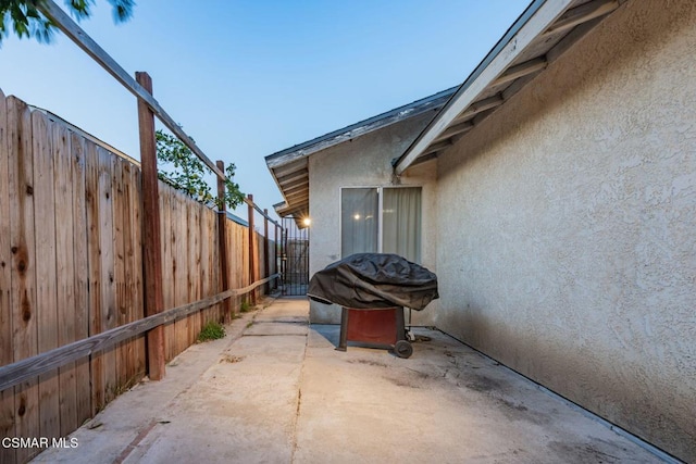 view of side of home featuring a patio