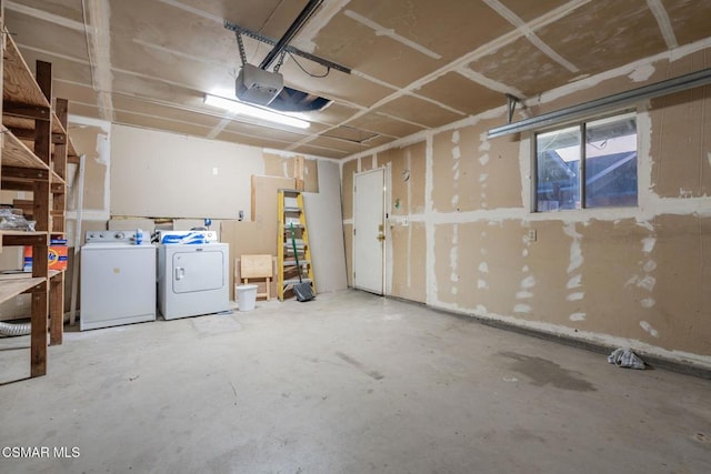 garage featuring washing machine and clothes dryer