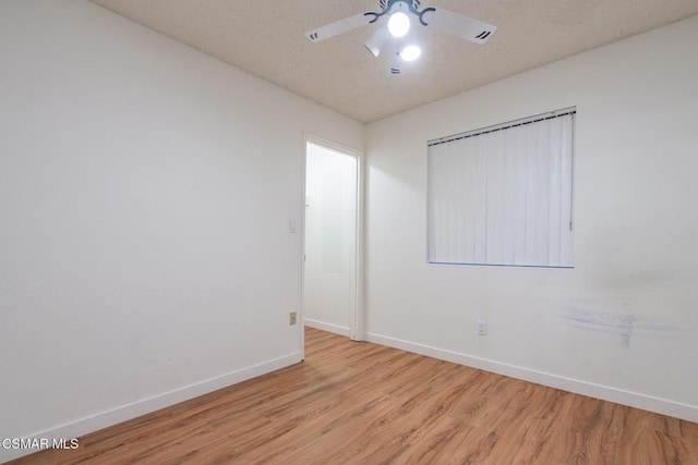 unfurnished room with ceiling fan and light hardwood / wood-style floors