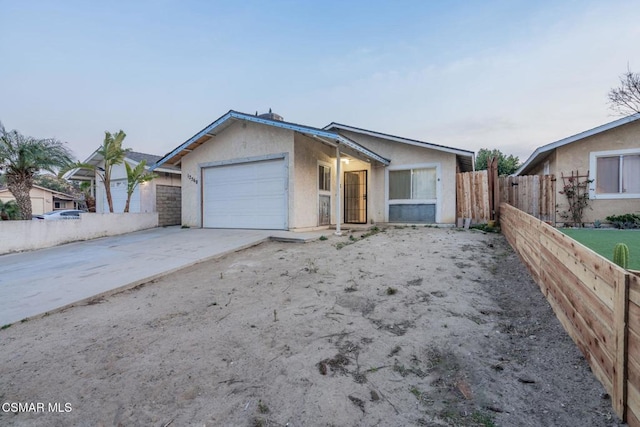 ranch-style house featuring a garage