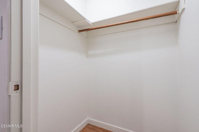 walk in closet featuring wood-type flooring