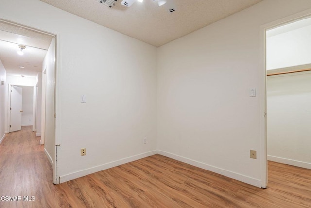 spare room with light hardwood / wood-style floors