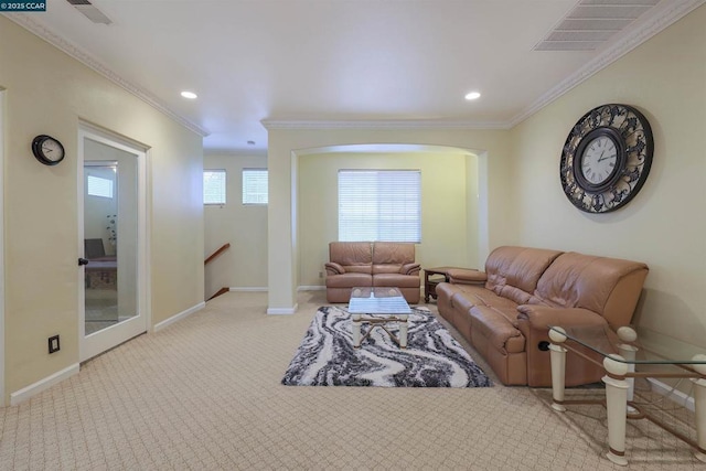 living room featuring crown molding and light colored carpet