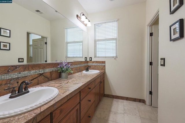 bathroom with vanity and decorative backsplash