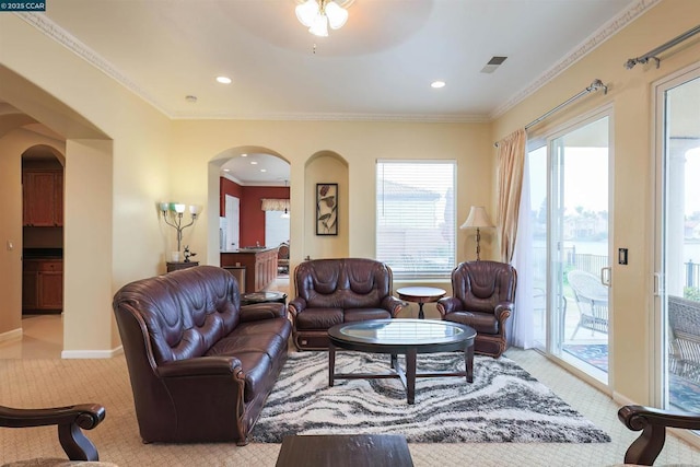 carpeted living room with crown molding