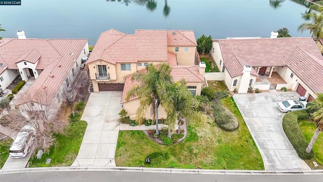 birds eye view of property featuring a water view