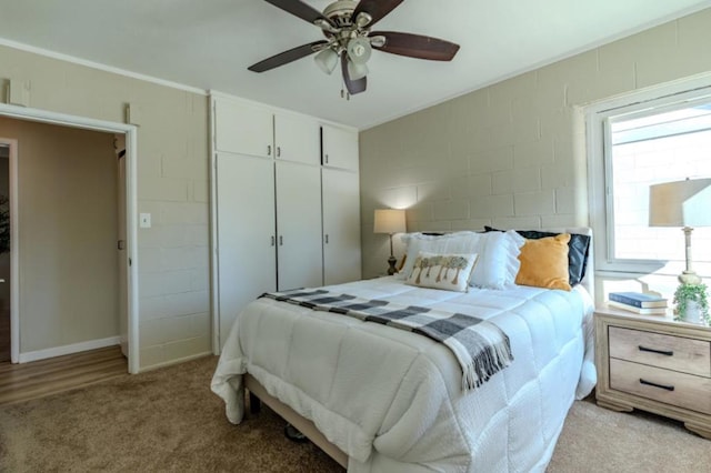 bedroom featuring ceiling fan and light colored carpet