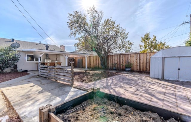 view of patio / terrace featuring a storage unit