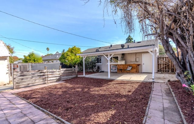 view of yard with exterior bar and a patio area