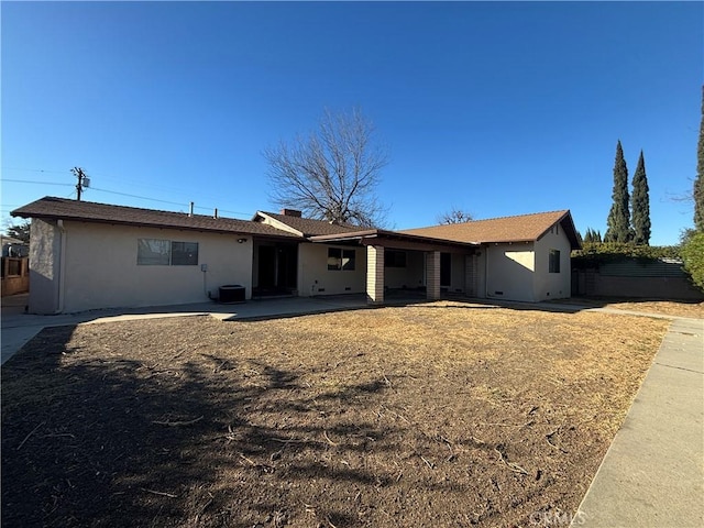 view of front of home featuring a patio area and central air condition unit