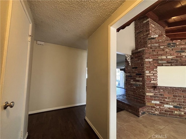 hall with a textured ceiling