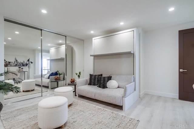 living room with light hardwood / wood-style flooring