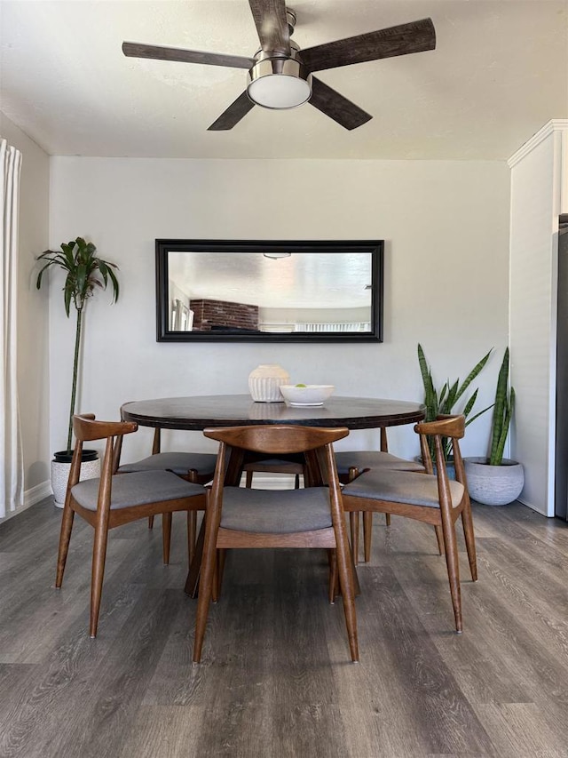 dining space featuring hardwood / wood-style floors and ceiling fan