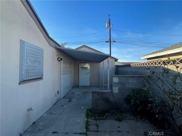 view of side of home featuring a patio area