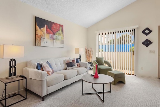 carpeted living room featuring vaulted ceiling